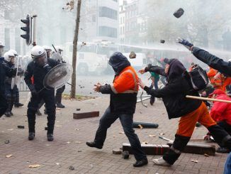 Police deploy water cannon and tear gas as 100,000 march in Brussels against austerity