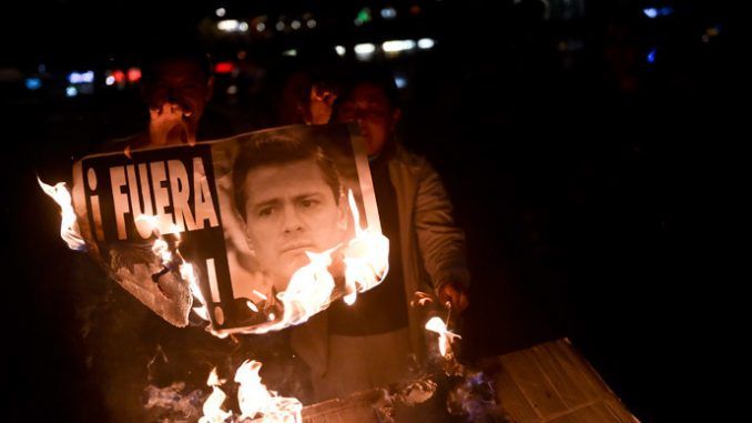 Mexicans march against president as fresh graves discovered