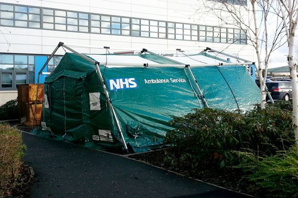 Hospital forced to erect TENT in car park as non urgent operations are cancelled