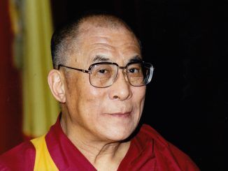 The Dalai Lama has urged the world to "stop praying for Paris"