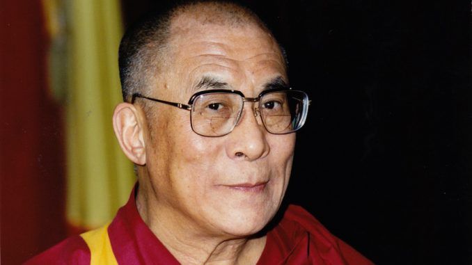 The Dalai Lama has urged the world to "stop praying for Paris"