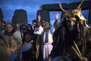 Revellers celebrate the winter solstice at Stonehenge on Salisbury Plain in southern England