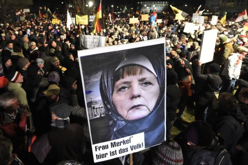 Hundreds of Germans call for Angela Merkel to be prosecuted for treason
