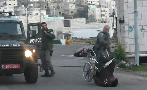 Israeli Police Officer Kicks Palestinian Man Out Of Wheelchair