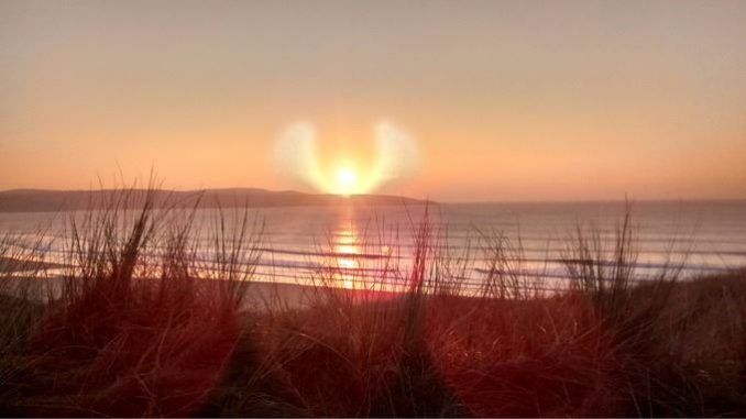 Angel Cloud Formation Appears In The Sky Above Beach In Cornwall