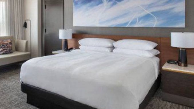 High-end hotel chain JW Marriott has been accused of attempting to normalize the chemtrail agenda by placing artworks on their walls featuring chemtrails sprayed on blue skies.