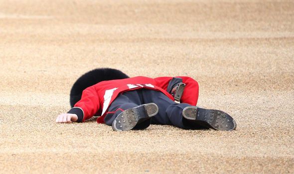 Royal Guardsman Collapses At Queens Trooping Of The Colour Parade