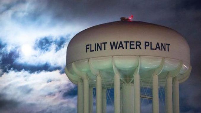 Six more state officials have been charged in connection with the Flint water crisis, as Governor Rick Snyder continues to evade responsibility for the disaster.