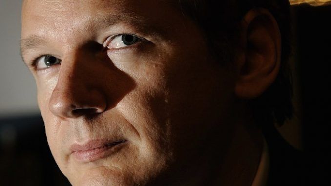Julian Assange has warned that a Clinton White House will see a merger between the private power of corporations and the military might of the state.