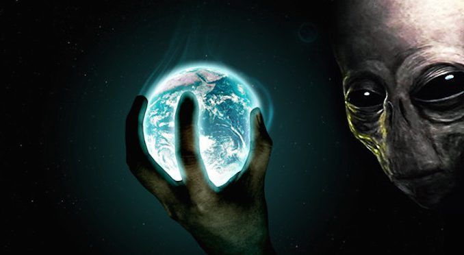 A senior Wall Street banker has claimed that the human race must be paying it’s debts to aliens.