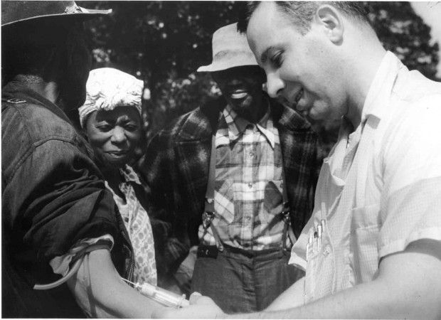 Photo of a doctor drawing blood from a Tuskegee test subject.