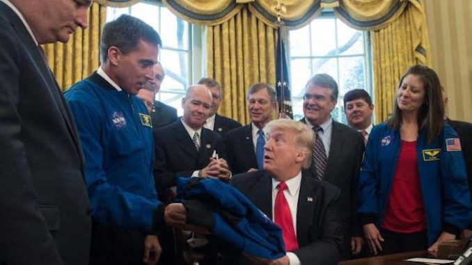 Trump signs new bill to send astronauts to Mars