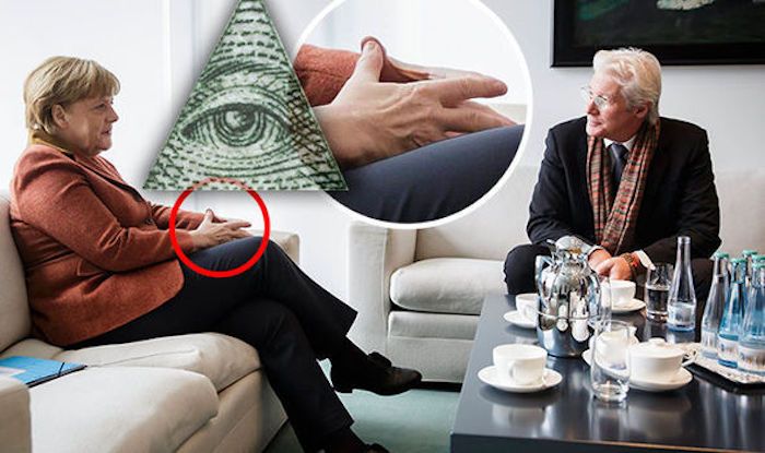 Angela Merkel has been caught on camera flashing Illuminati hand sign at Richard Gere in Berlin, and eye-witnesses claim the Hollywood actor responded by flashing the sign back at her.