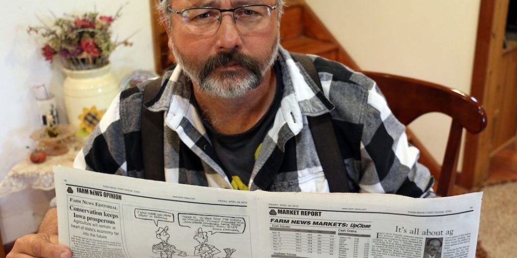 Monsanto forced an Iowa newspaper to fire a cartoonist after he dared to criticize the salary of their CEO.