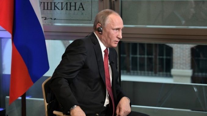 Putin says that men in dark suits control Washington and that all US presidents are really just puppets