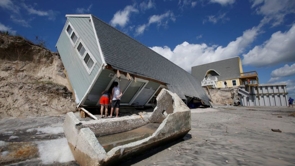 An MIT economics professor warns that mortgage defaults resulting from hurricane damage will send the world into another global recession.