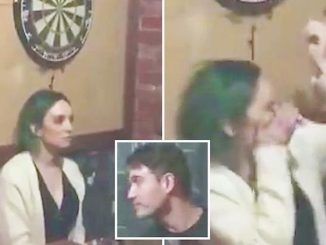 A video shows a young woman getting a dart in the eye after repeatedly daring her boyfriend to throw it at a dartboard just above her head.