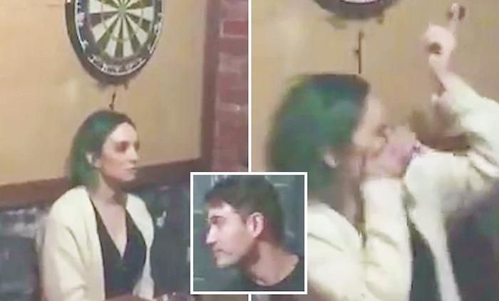 A video shows a young woman getting a dart in the eye after repeatedly daring her boyfriend to throw it at a dartboard just above her head.