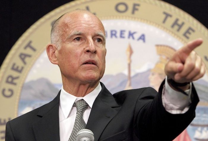 California Governor Jerry Brown makes it illegal to shower and do laundry on the same day