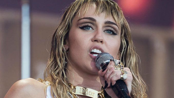 Miley Cyrus told Elle she will not consider having a child until she is confident her children can “live on an earth with fish in the water.”