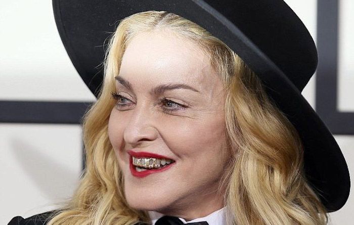 Madonna sings about assassination in front of her children