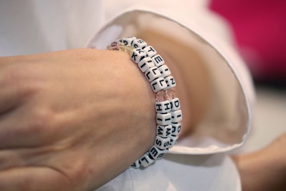 One of Epstein's victims, identified only as Jane Doe 15, wore an ‘EPSTEIN DIDN’T KILL HIMSELF’ bracelet during press conference Monday.