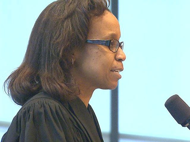 Judge Denise J. Casper told jurors that a "true threat" does not include "caustic" or "sharp" political attacks.
