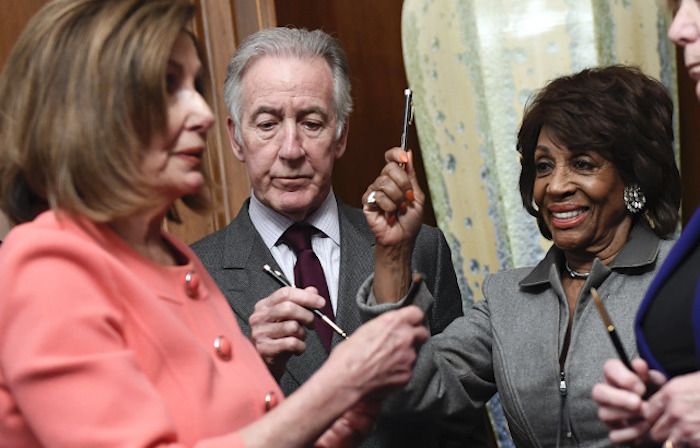 Nancy Pelosi uses over a dozen commemorative pens to sign articles of impeachment before handing them out like prizes to fellow Democrats