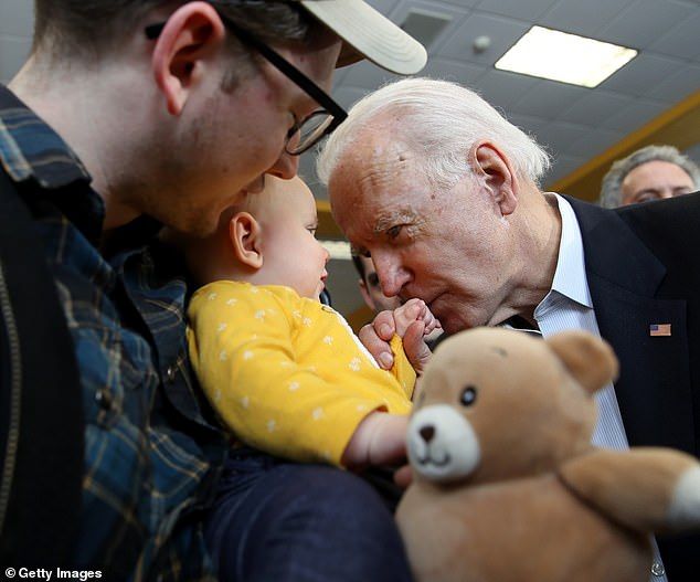 At one point, Biden could be seen interacting with a baby as he kissed the child's hands