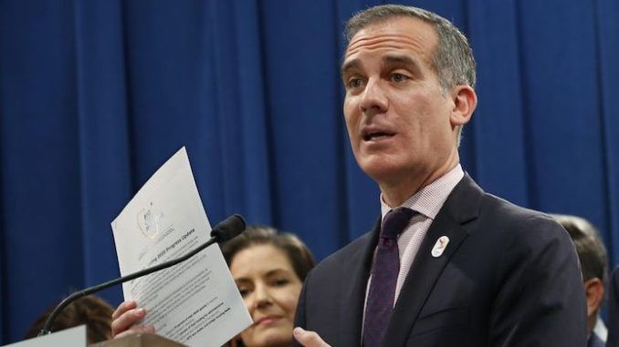 Los Angeles Mayor Eric Garcetti slams Trump and warns of at least two more months of lockdown