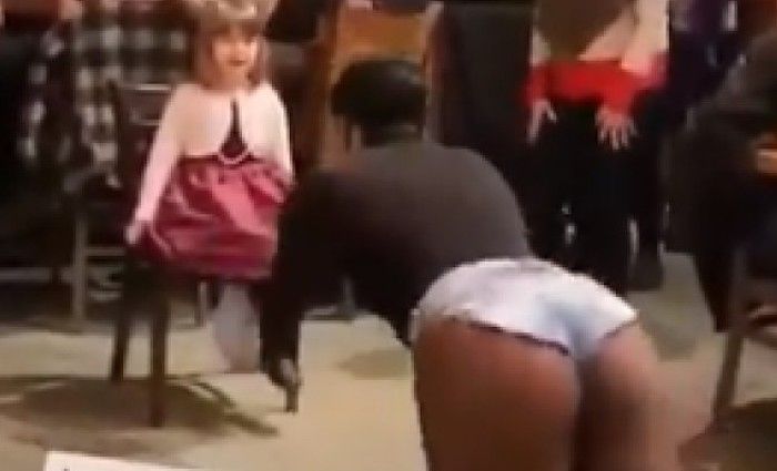 A video posted to Tik Tok shows a drag queen dancing seductively in front of a very young girl as adults in the room clap and cheer.