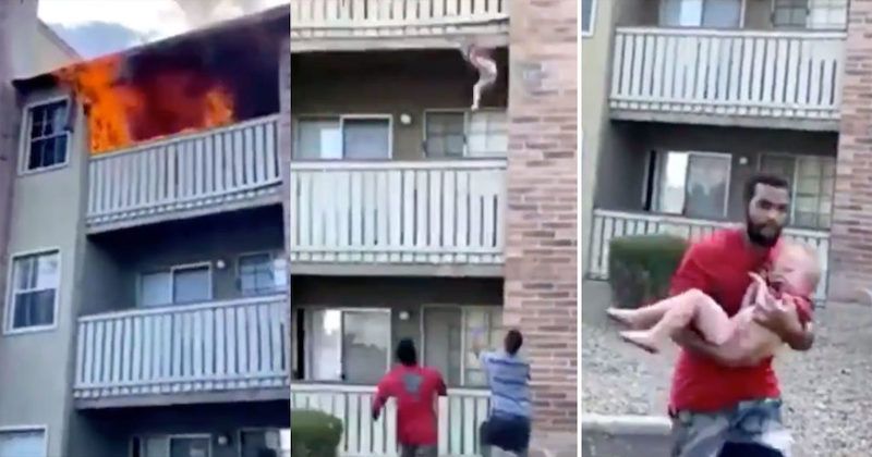 A former Marine and college wide receiver heroically saved the life of a 3-year-old boy by catching him after he was thrown from a burning building by his mother, dramatic cellphone footage shows.