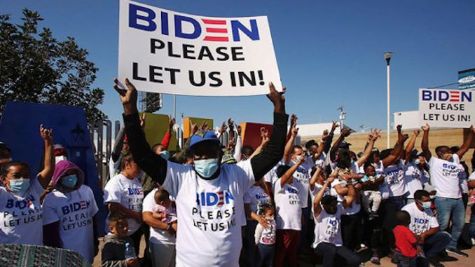 Illegals wearing Biden t shirts flood border begging to be let in