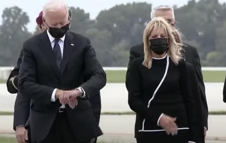President Biden has come under fire for allegedly glancing at his after a ceremony at Dover Air Force Base in Delaware for the 13 US troops killed in Afghanistan.