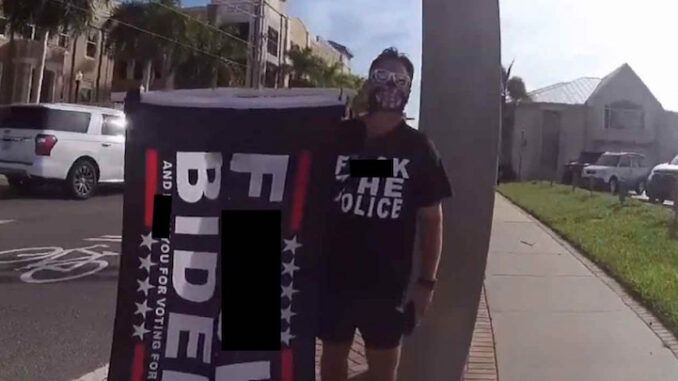 Trump supporter prosecuted and fined for waving F-Biden flag