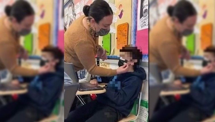 Parents horrified after Democrat teacher photographed taping a mask to a young child's face