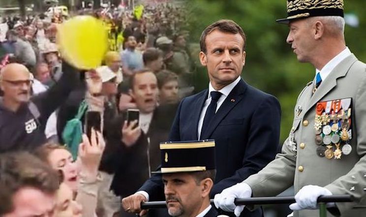 Macron trembles with fear as crowd loudly boo him at Bastille Parade in France