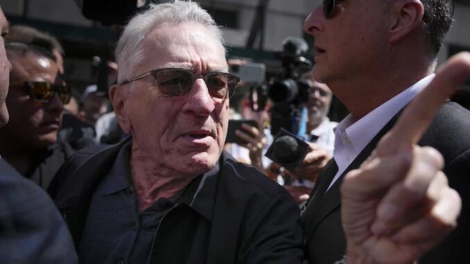 Robert Niro explodes with rage as crowd chant 'your movies suck' during Biden event.
